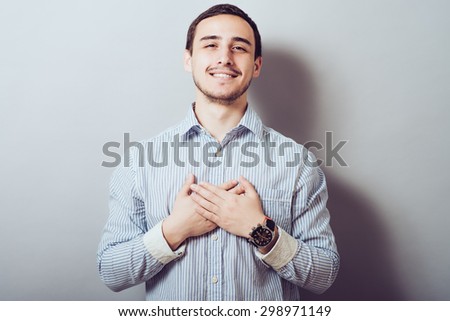 Handsome  male resting hands on his chest