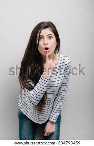 girl touching her lower lip
