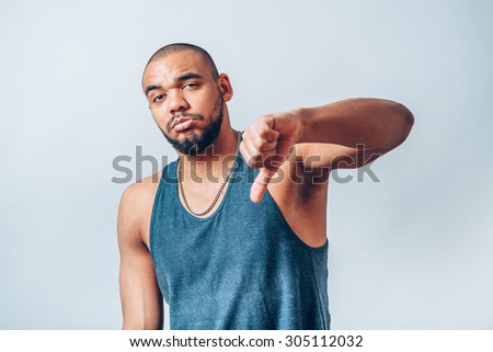 black man backs his chin with his fist