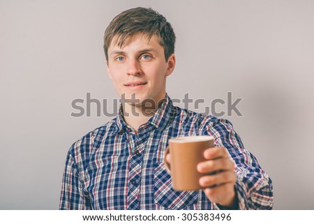 man with a cup of tea or cocoa