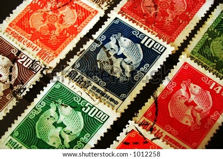 Colorful postmarked stamps from the Republic of China in a stamp collecting book.