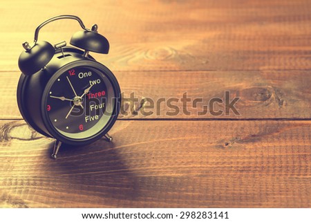Alarm Clock On Wood Table