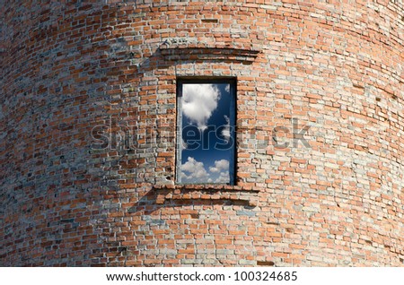circular brick tower in the windows of a sunny sky