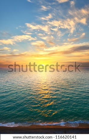 Expanse of the sea against the sunset sky. Beautiful seascape. Natural composition.