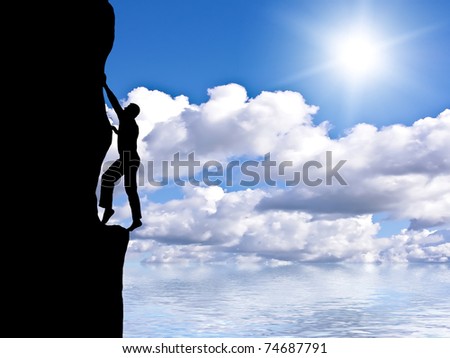 rock climber conquering a mountain on the background of sky and bright sun