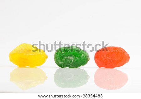 colored sweet fruits on a white background
