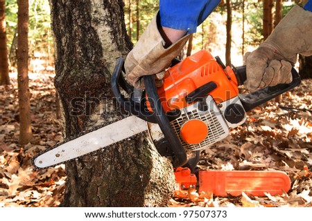 Chain saw in hands