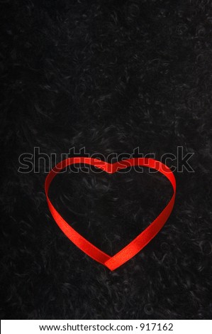 ribbon in a heart shape on a black background