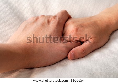 holding hands in bed