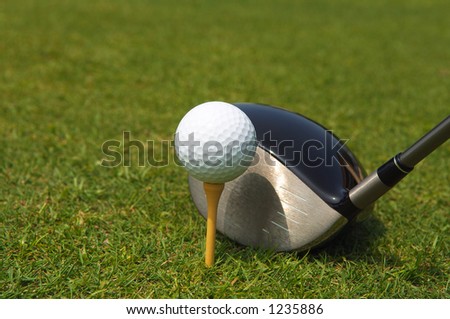 golf ball teed up for hitting with a driver