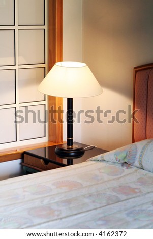 Bedroom in a resort hotel lamp and bed