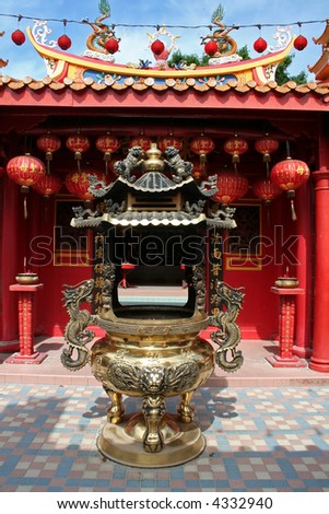 Traditional chinese temple red design with brass incense holder