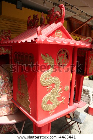 Small red traditional chinese family shrine with dragon motif