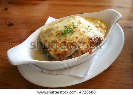 Lasagna in baking dish Italian cuisine melted cheese