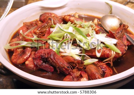 Cooked prawn dish with gravy restaurant setting