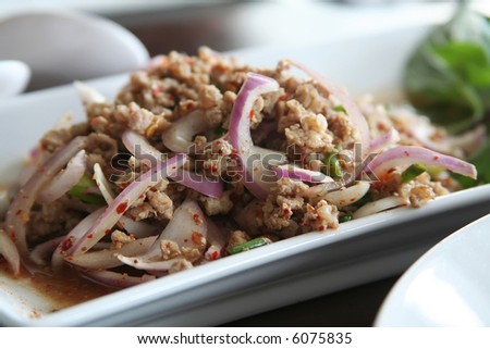 Pork and onion dish traditional thai cuisine restaurant setting