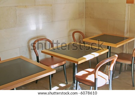 Casual sunny bistro cafe dining tables and chairs