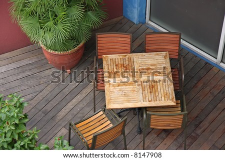 Overhead view of casual dining restaurant with wooden table and chairs