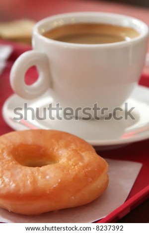 Donut and coffee mug on a fast food tray