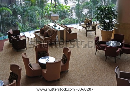 Elegant cafe lounge waiting area with tables and sofas