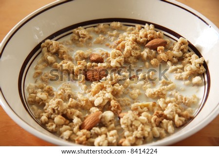 Bowl of breakfast cereal corn flakes in milk