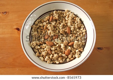 Breakfast cereal corn flakes with almonds in bowl