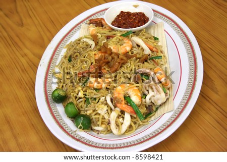 Chinese fried seafood noodles with prawns and squid