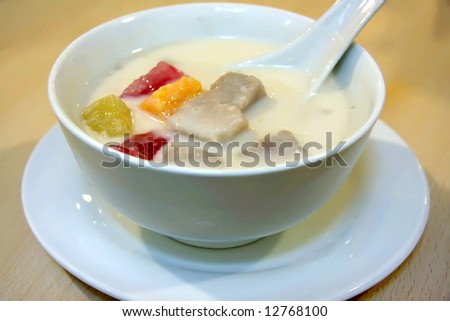 Traditiional asian sweet dessert of coconut milk and fruits