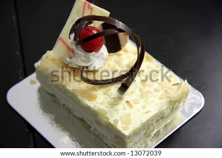 Sansrival white sponge cake with icing rectangle cut