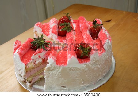 Strawberry cream cake with icing and fresh fruit