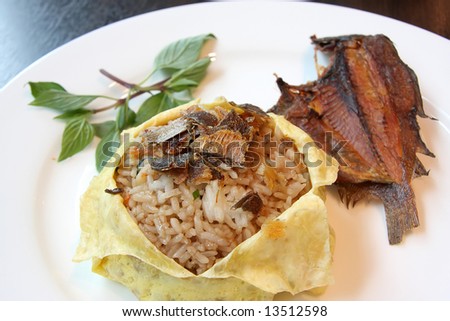 Plate of thai fried rice served with dried fish