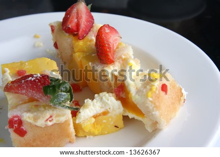 Mango mousse cake decorated with strawberries sweet dessert