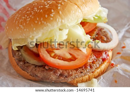 Fastfood hamburger bun on paper wrapper
