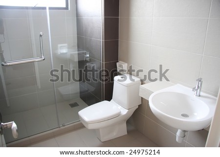 Modern clean toilet bathroom interior with white porcelain