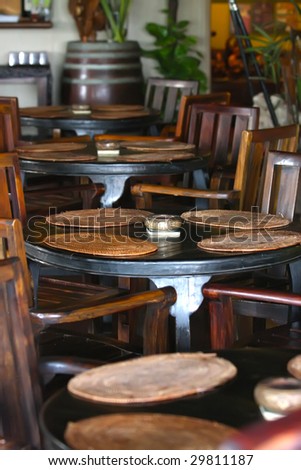 Balinese style restaurant with wooden traditional furniture