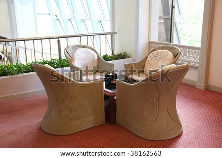Elegant casual wicker furniture in sunny room