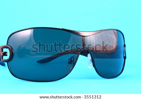 Sunglasses with tinted lenses on white