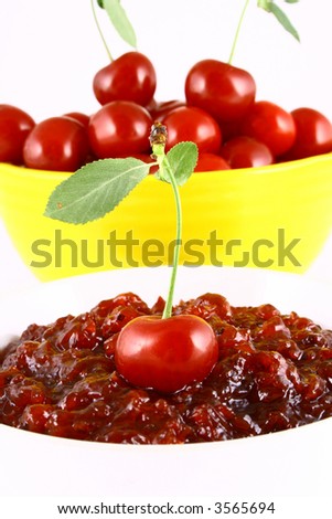 red cherry jam isolated on white -brown