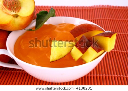 Peach jelly  on white background in jar-desser