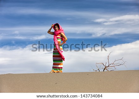 Woman models in desert.