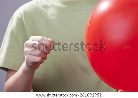 Popping a balloon.