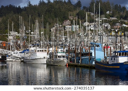Newport, Oregon USA - March 31, 2015. Commercial  and private fishing boats docked at the historic bay front in Newport, Oregon are ready for their time out in the ocean.