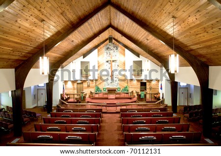 The warm interior of a church.
