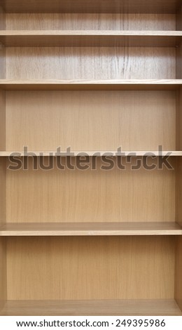 Close-up of shelves of a new empty book-case