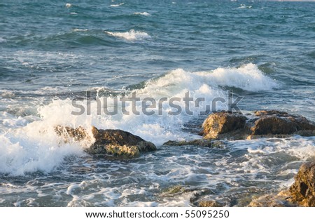 Sea wave rolling on the coast rocks