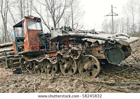 stock-photo-old-rusty-tractor-in-an-autumn-forest-58245832.jpg