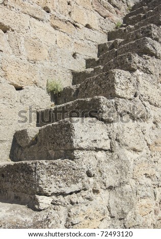 Stone ladder on an old medieval wall