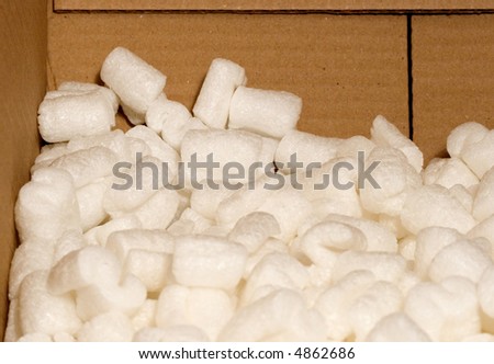 cardboard box with white packing peanuts