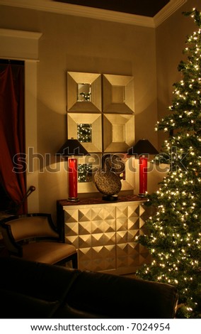 Holiday living room lit by two lamps and Christmas tree