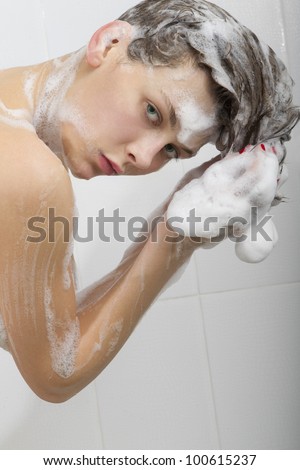 Portrait of young sexy woman with soap foam